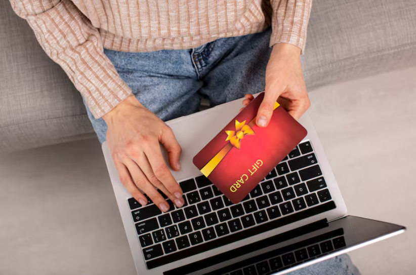 Person checking a discounted gift card on a laptop using the 3-Tab Trick to verify safety.
